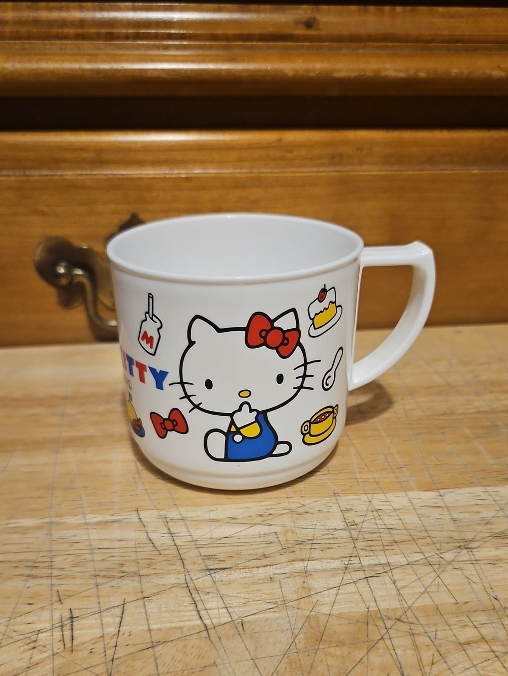 Sanrio Hello Kitty White Kids Cup with Red Bow and Colorful Accents